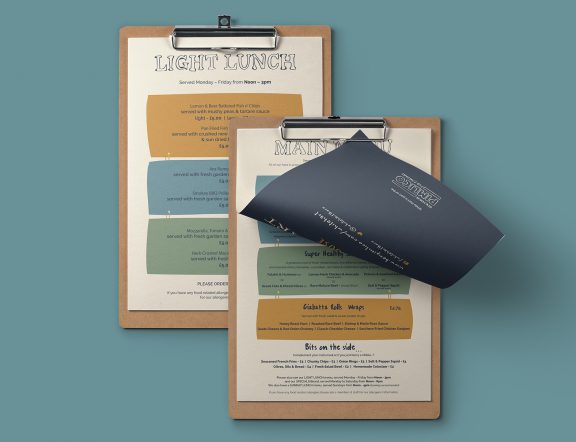White Hart pub menu on clipboard, as part of a larger branding project.